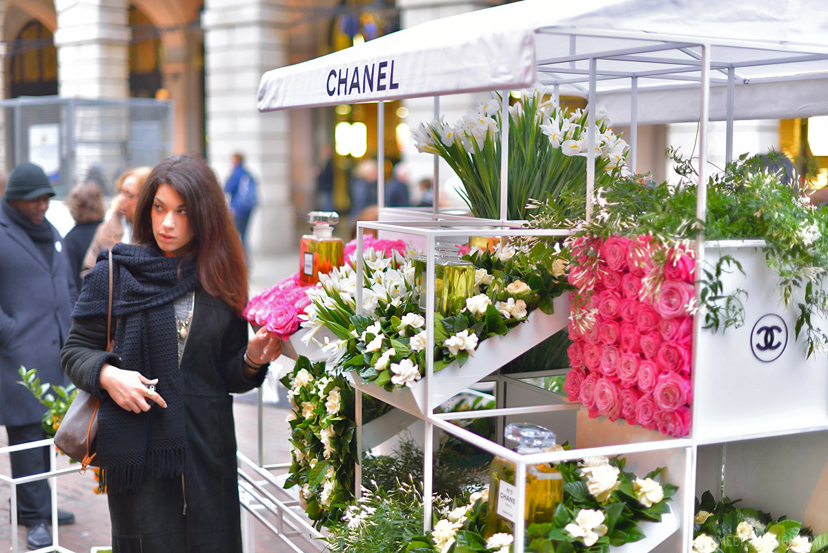 A giant replica of a red, Christmas-styled Chanel No 5 perfume